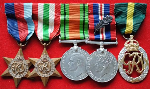 World War Two British Territorial Officers Medal group of five Awards including Mentioned in Despatches (M.I.D) Oak leaf